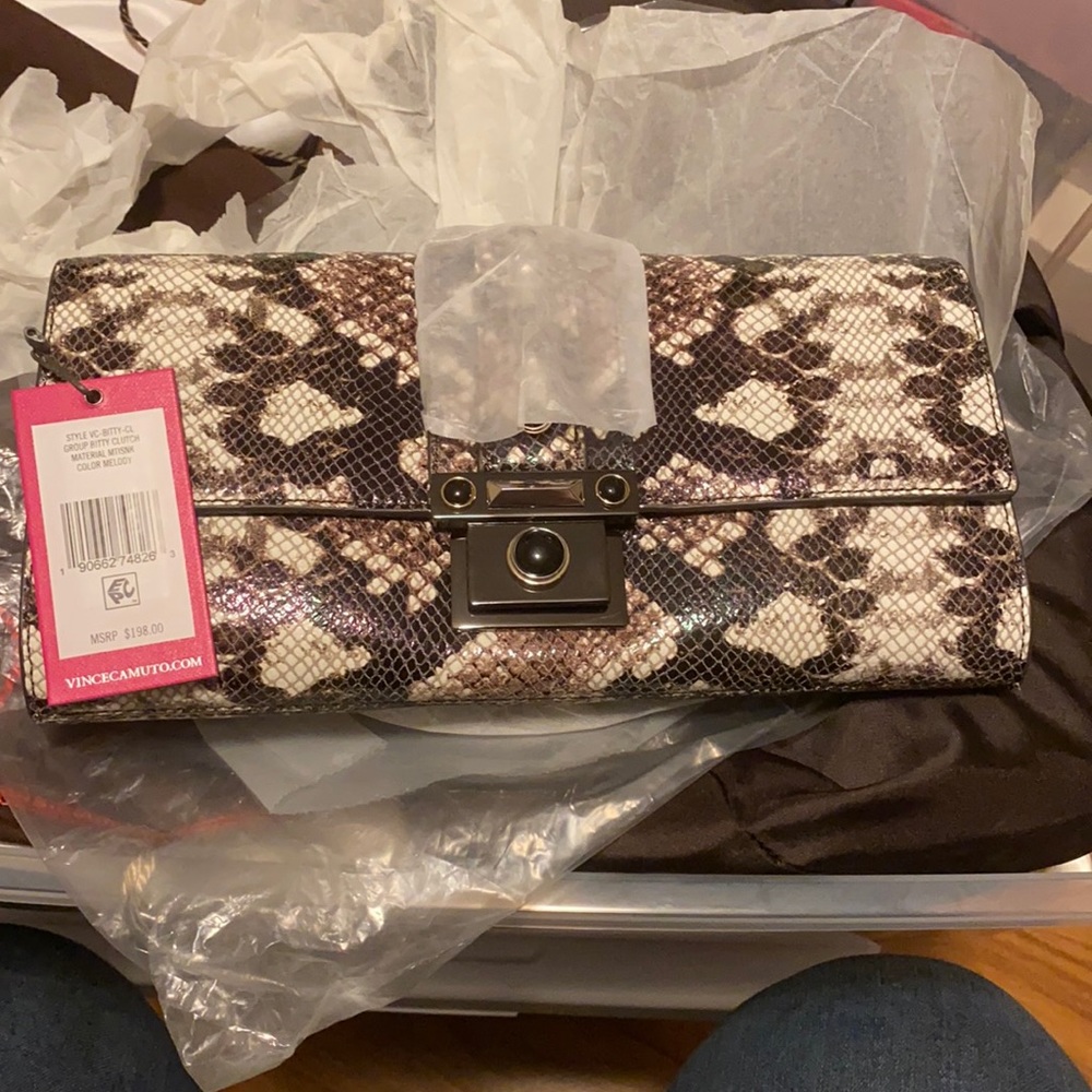 Vince Camuto- clutch with shoulder strap and dust bag. Brand new.